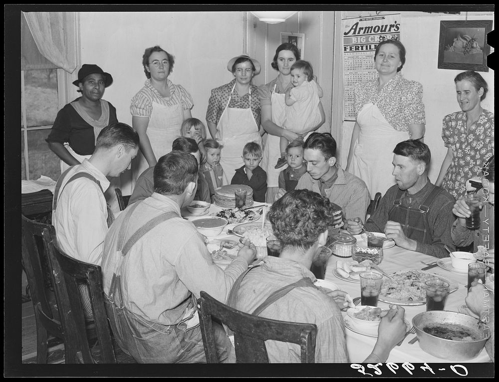 [Untitled photo, possibly related to: Some of the Wilkins clan at dinner on corn-shucking day at home of Mrs. Fred Wilkins.…