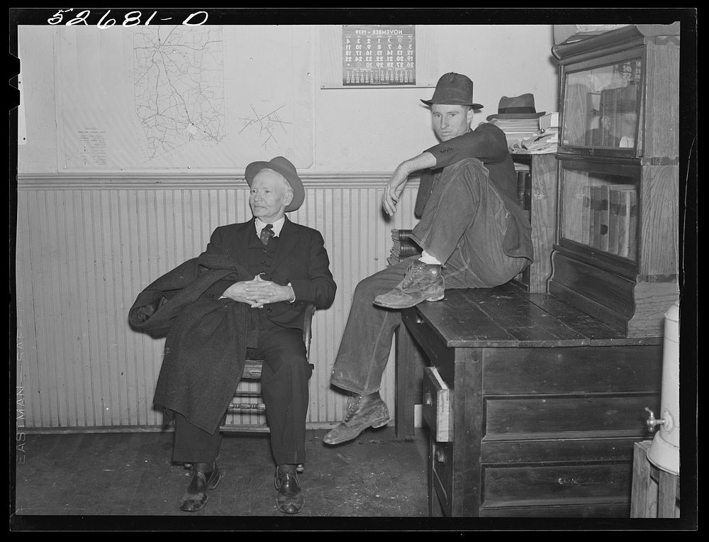 [Untitled photo, possibly related to: Group of men killing time during dinner hour in sheriff's office. Granville County…