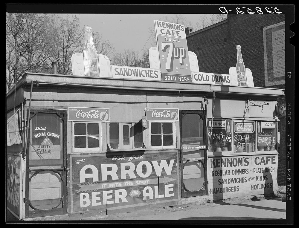Cafe next to tobacco warehouse. Mebane, Orange County, North Carolina. Sourced from the Library of Congress.
