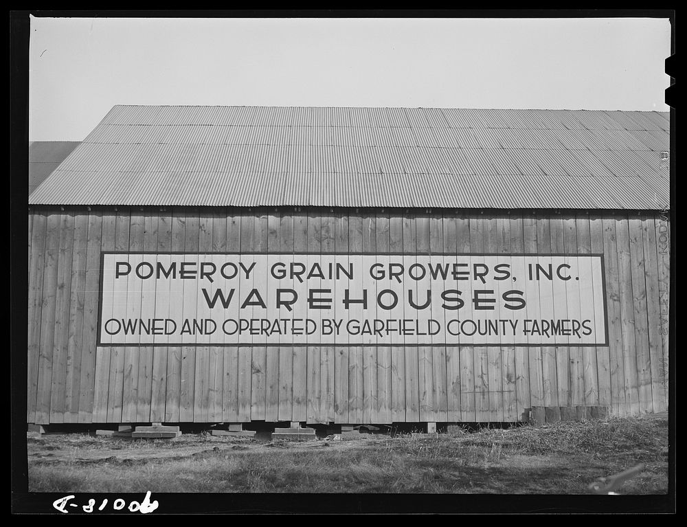 Sign on wheat sack warehouse. Pomeroy, Washington by Russell Lee