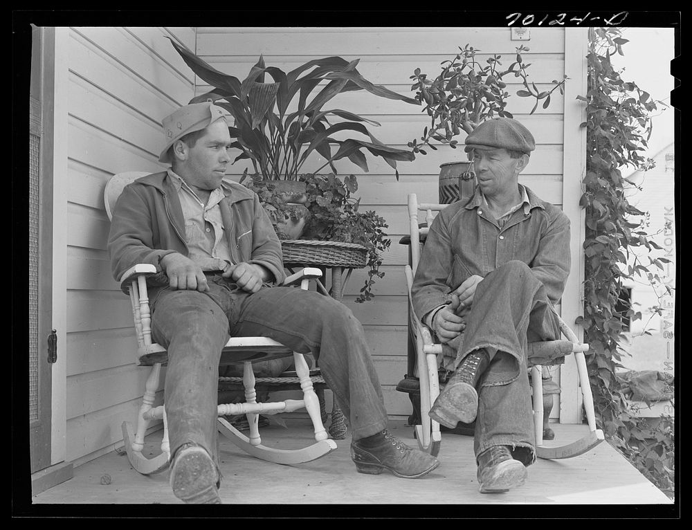 [Untitled photo, possibly related to: Farmer and son, members of the Boundary Farms, FSA (Farm Security Administration)…