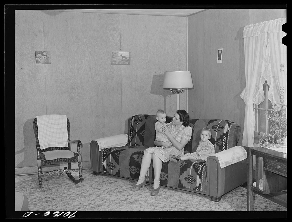 [Untitled photo, possibly related to: In the living room of farm family, members of Boundary Farms, FSA (Farm Security…