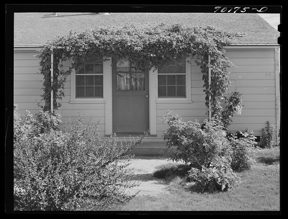 Front door of house for permanent farm workers at the FSA (Farm Security Administration) farm family migratory labor camp.…