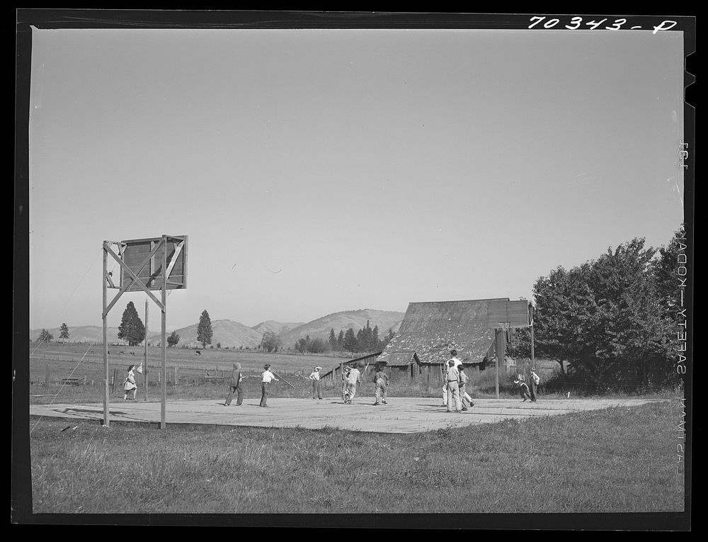 Basketball game. Children living at the FSA (Farm Security Administration) mobile camp for migratory farm workers. Odell…