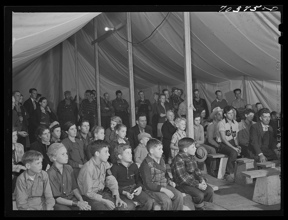 [Untitled photo, possibly related to: Audience at amateur night at the FSA (Farm Security Administration) mobile camp for…