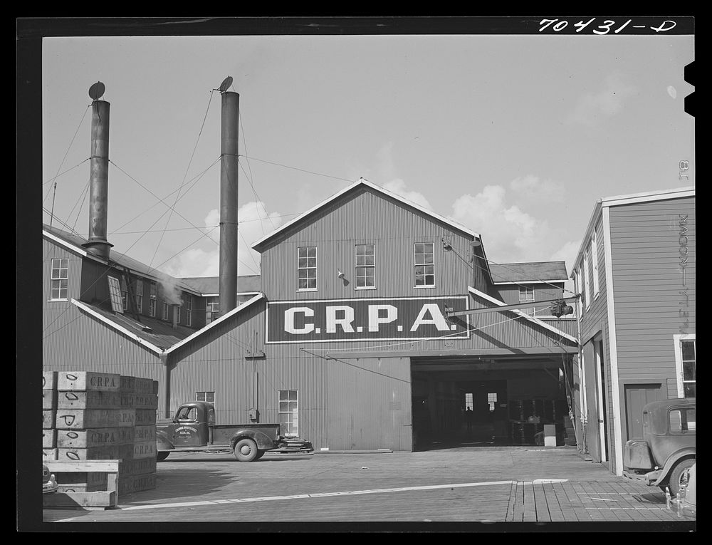 Entrance to the Columbia River Packing Association plant. Astoria, Oregon by Russell Lee
