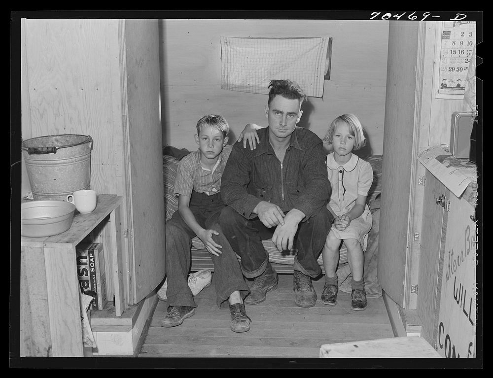 Workman at Umatilla ordnance fepot and his children in homemade trailer. Stanfield, Oregon by Russell Lee