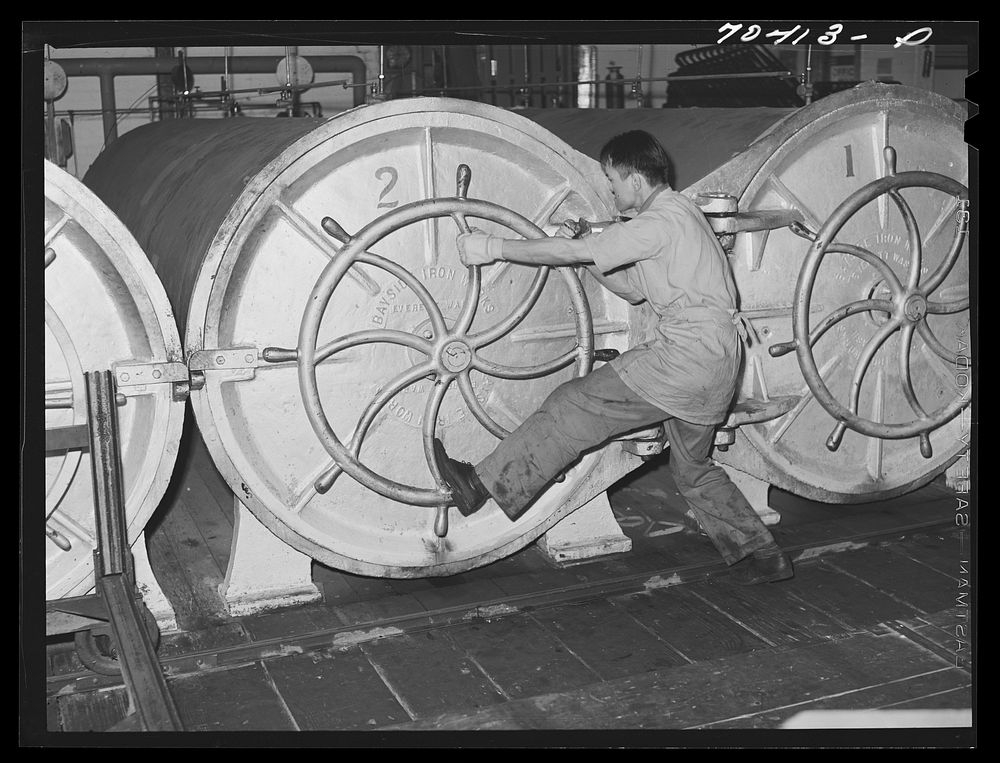 [Untitled photo, possibly related to: Closing ovens in which canned salmon is cooked. Columbia River Packing Association…