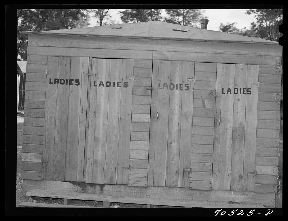 [Untitled photo, possibly related to: Sanitary facilities at cabin-trailer camp used by workmen and their families.…