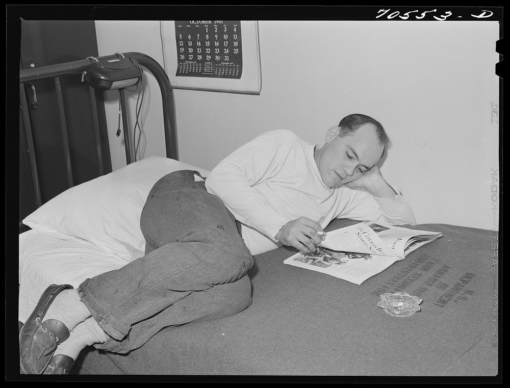 Workman at Navy shipyards, Bremerton, Washington in his room at the FSA (Farm Security Administration) dormitories by…