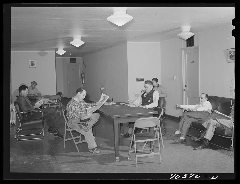 Men who work at the Navy shipyards in the community room at the FSA (Farm Security Administration) dormitories. Bremerton…