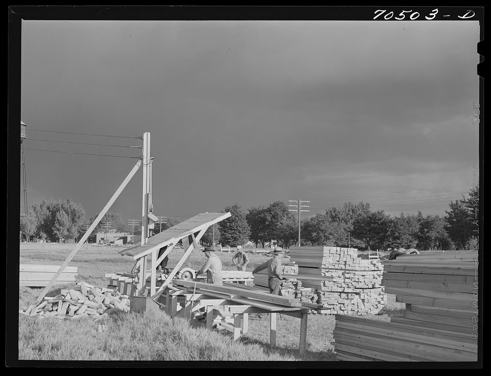 Cutting lumber to length for construction of FSA (Farm Security Administration) trailer camp sanitary units. Stanfield…