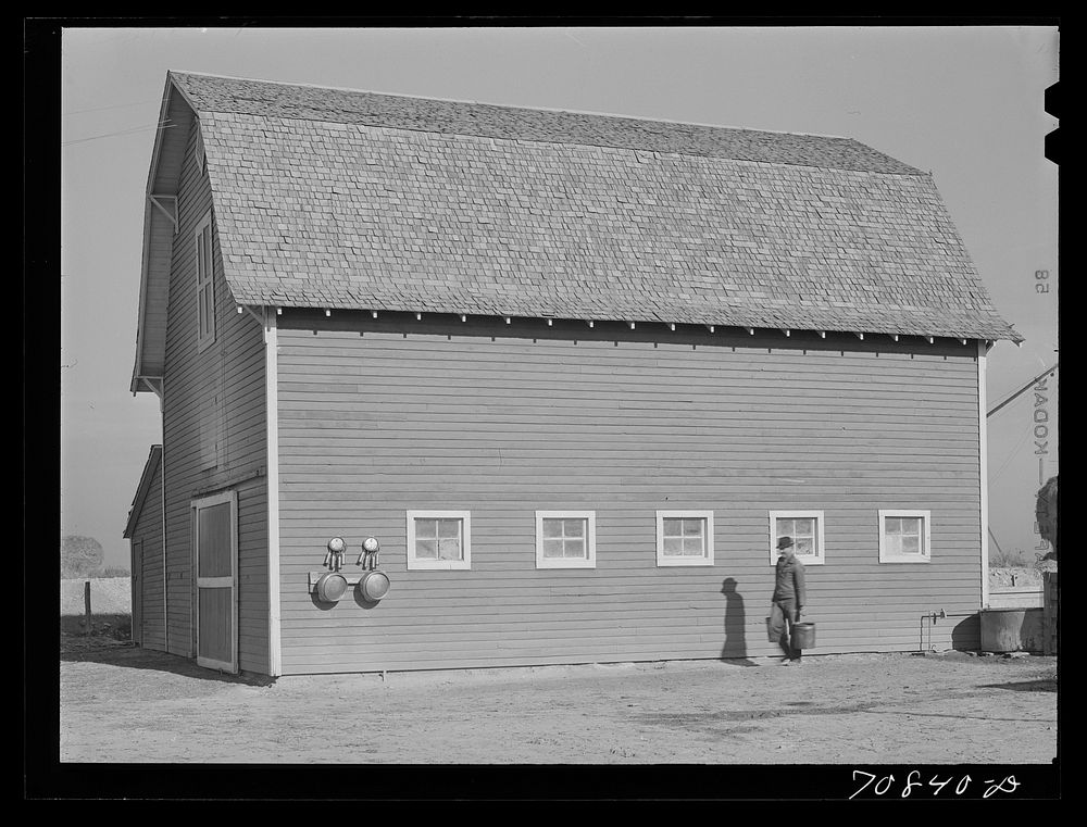 Farmer and his barn. Black Canyon Project, Canyon County, Idaho by Russell Lee