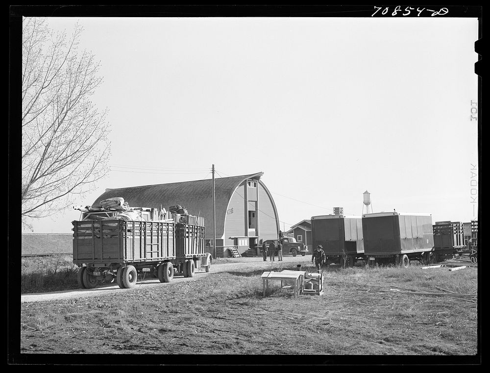 Equipment from the FSA (Farm Security Administration) mobile camps arrives at the permanent camp at Caldwell, Idaho by…