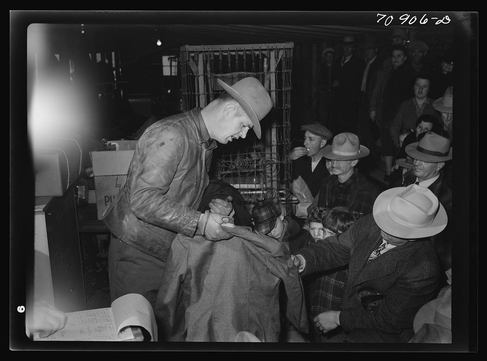 [Untitled photo, possibly related to: Auction of secondhand garments. Boise, Idaho] by Russell Lee