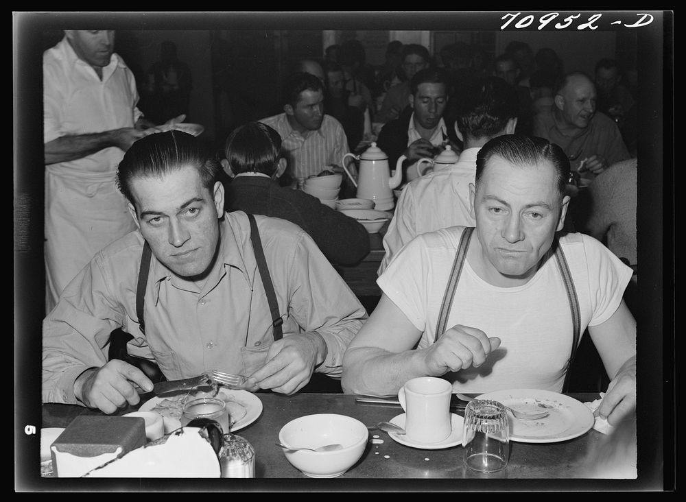 Workmen at Shasta Dam eating dinner at the commissary. Shasta County, California by Russell Lee