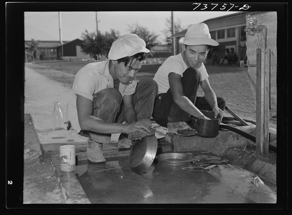 Twin Falls, Idaho. FSA (Farm Security Administration) farm workers' camp. Japanese washing dishes by Russell Lee