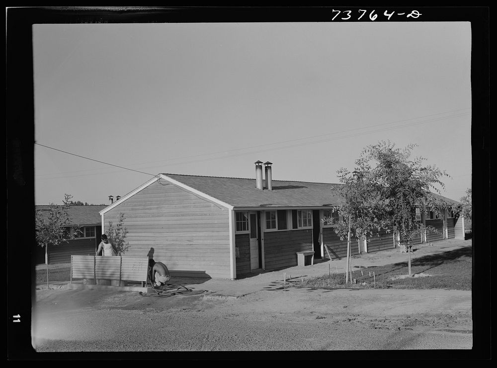 [Untitled photo, possibly related to: Twin Falls, Idaho. FSA (Farm Security Administration) farm workers' camp. Row shelters…