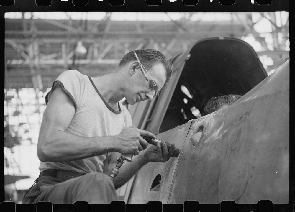 Nashville, Tennessee. Vultee Aircraft Company. Riveting a fuselage on a sub-assembly line. Sourced from the Library of…