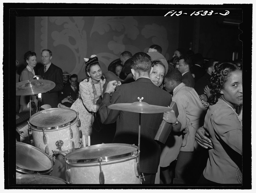 Dancing to the music of "Red" Sounders [i.e. Saunders] and his band at the Club DeLisa, Chicago, Illinois. Sourced from the…