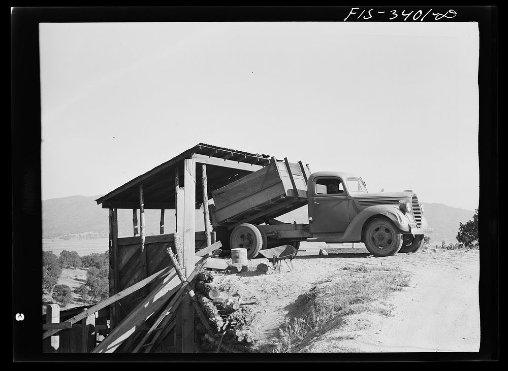 Kern County, California. Tugsten Chief Mill. Dumping tungsten ore into the hopper by Russell Lee