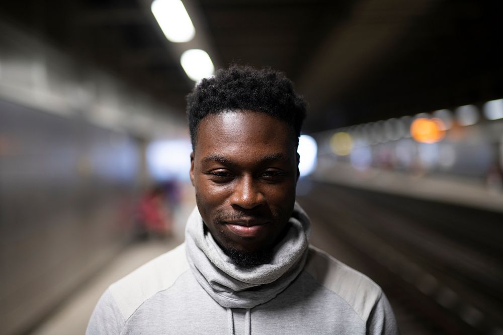 Portrait of a man at a subway platform