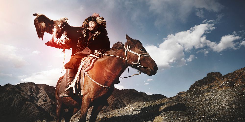 Kazakh men traditionally hunt foxes and wolves using trained golden eagles. Olgei,Western Mongolia.