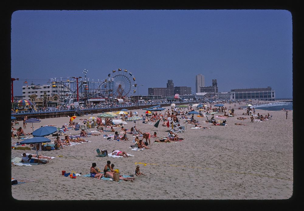 Beach, boardwalk overall, Asbury Park, New Jersey (1978) photography in high resolution by John Margolies. Original from the…