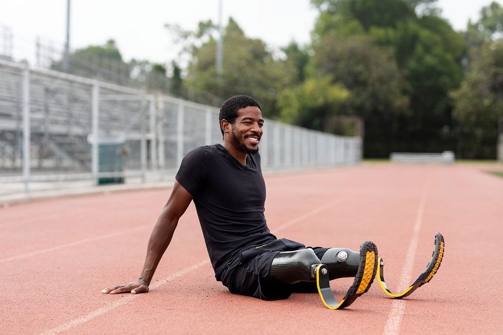 Paralympic athlete relaxing by the running track 