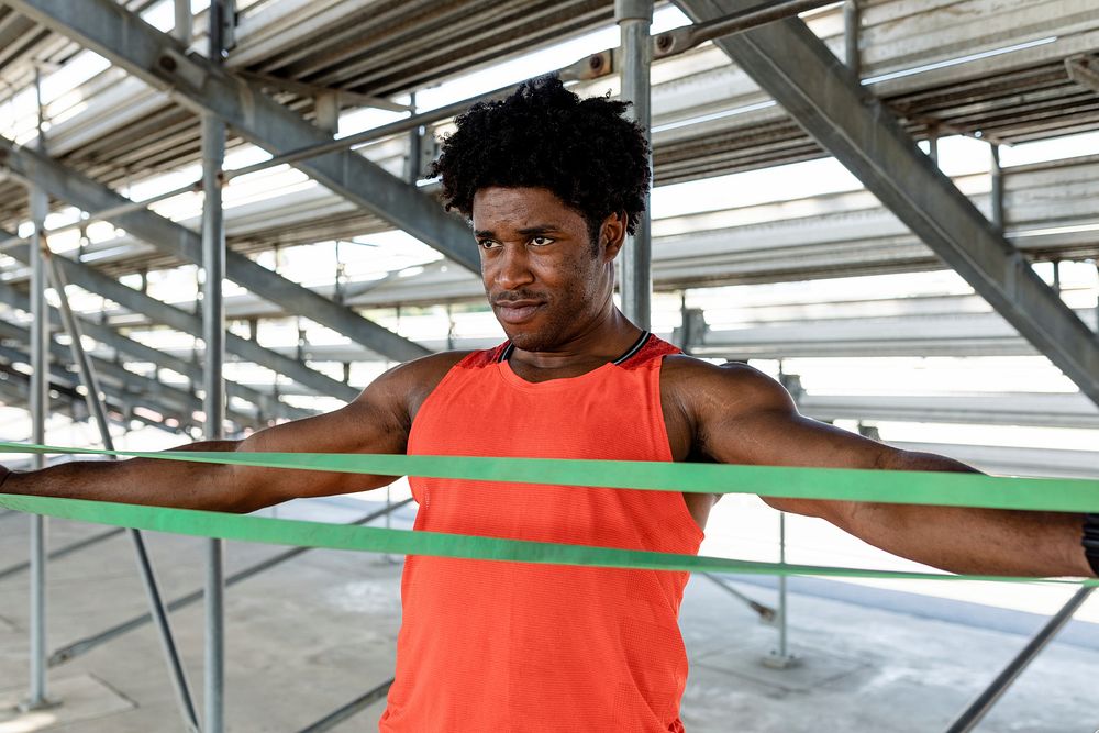 Male athlete using a resistance band