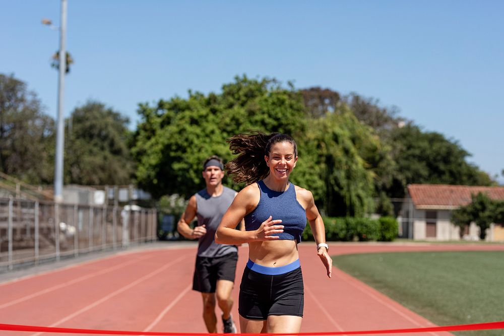 Man and woman runners competiong, athletic race competition 