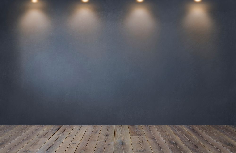 Dark gray wall with a row of spotlights in an empty room