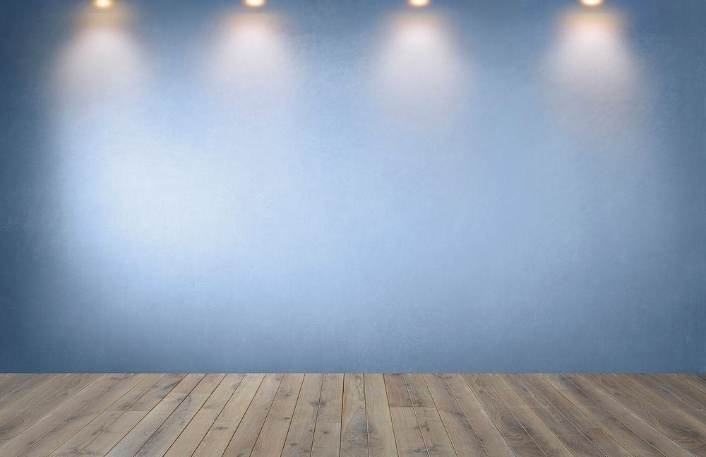 Blue wall with a row of spotlights in an empty room