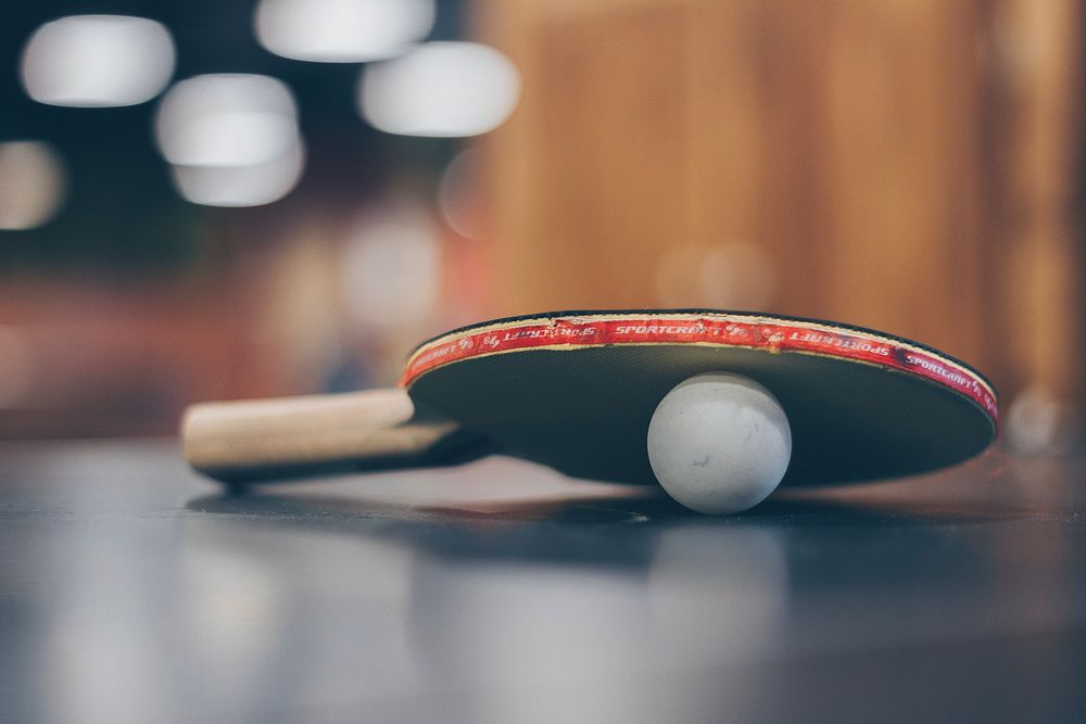 Ping pong paddle and ball. Free public domain CC0 photo.