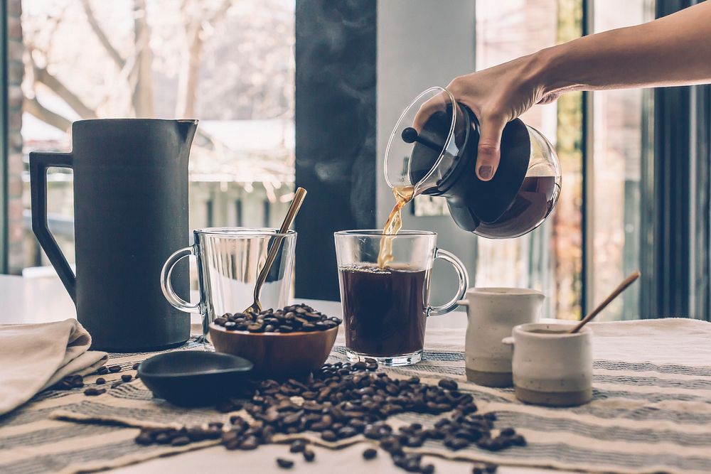 Free hand pouring coffee photo, public domain drink CC0 image.