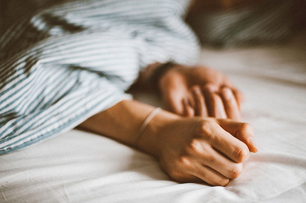 Free woman hands and arms on bed image, public domain people CC0 photo.