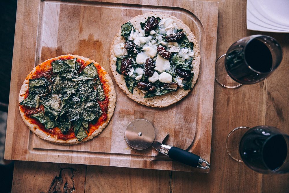 Free two pizza and two glasses of red wine on wooden board image, public domain food CC0 photo.