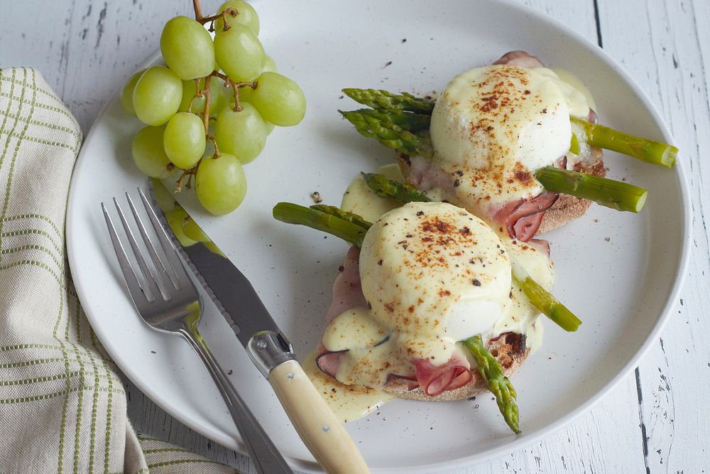 Free egg benedict with hollandaise sauce and grape image, public domain food CC0 photo.