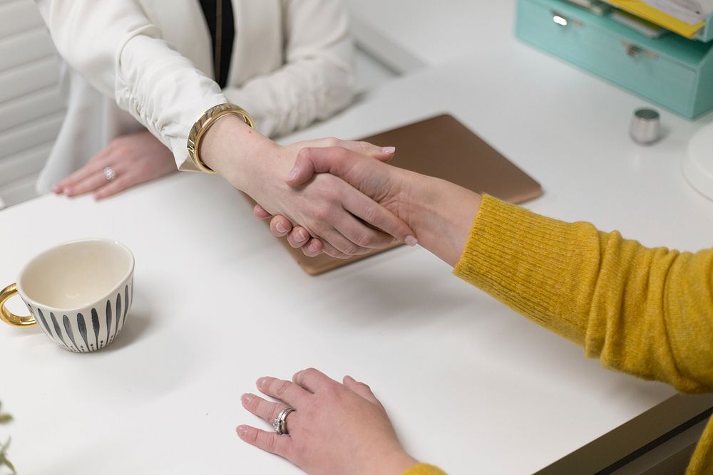 Free hand shaking business meeting image, public domain people CC0 photo.