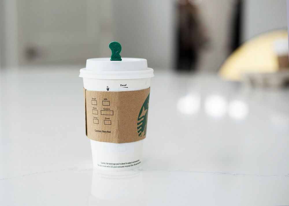 Free Starbucks coffee cup on table photo, public domain beverage CC0 image.