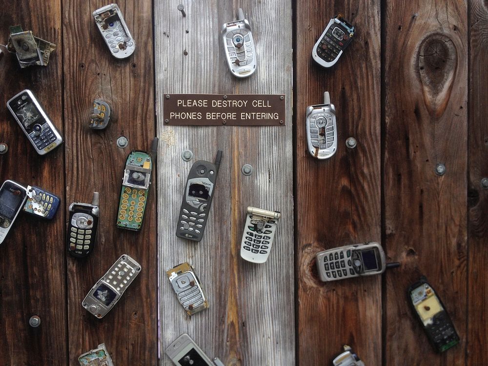 Free Old Broken Mobile Phone on Wood photo, public domain device CC0 image.