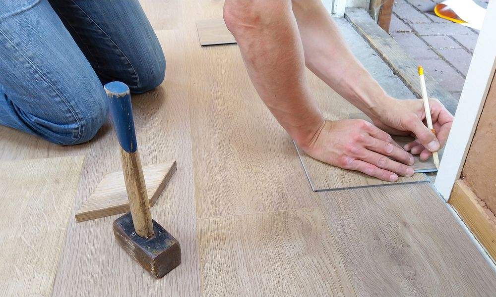 Free hand measuring floor photo, public domain CC0 image.