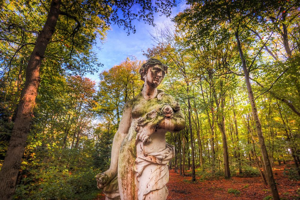 Sculpture of a women amongst trees, free public domain CC0 photo