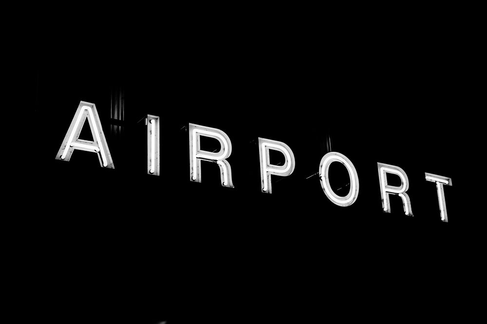 Free airport neon light black and white image, public domain CC0 photo.