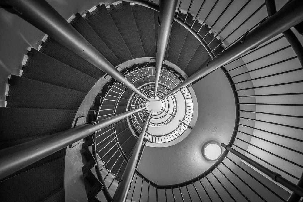 Free spiral staircase in black and white photo, public domain CC0 image.