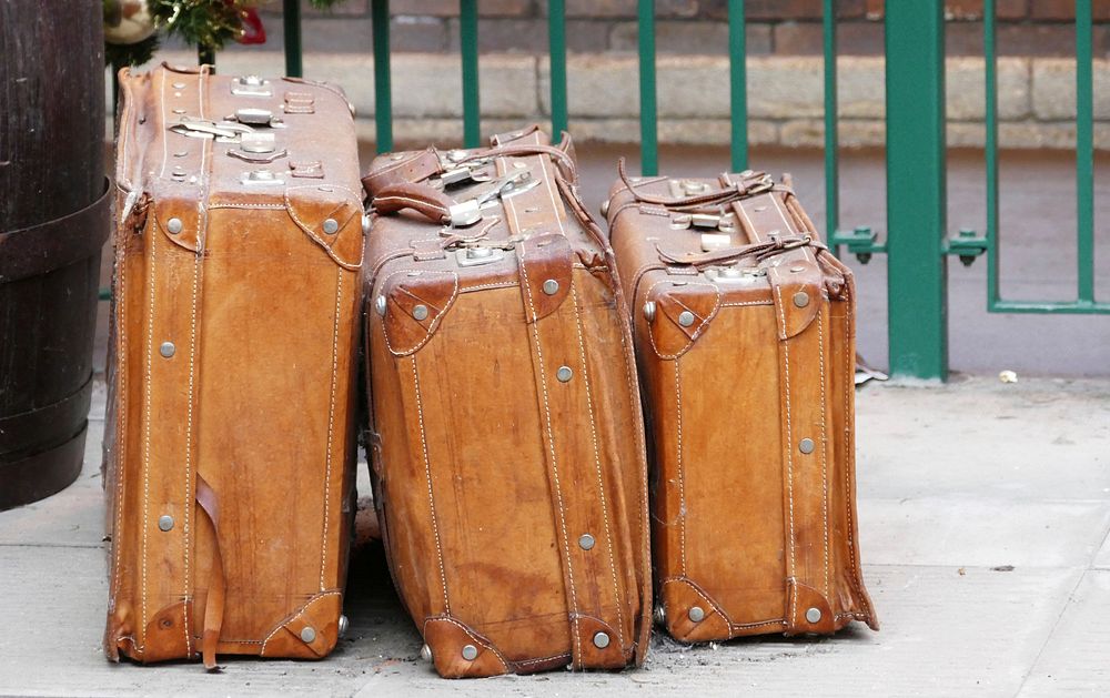 Free vintage luggage on street image, public domain travel CC0 photo.