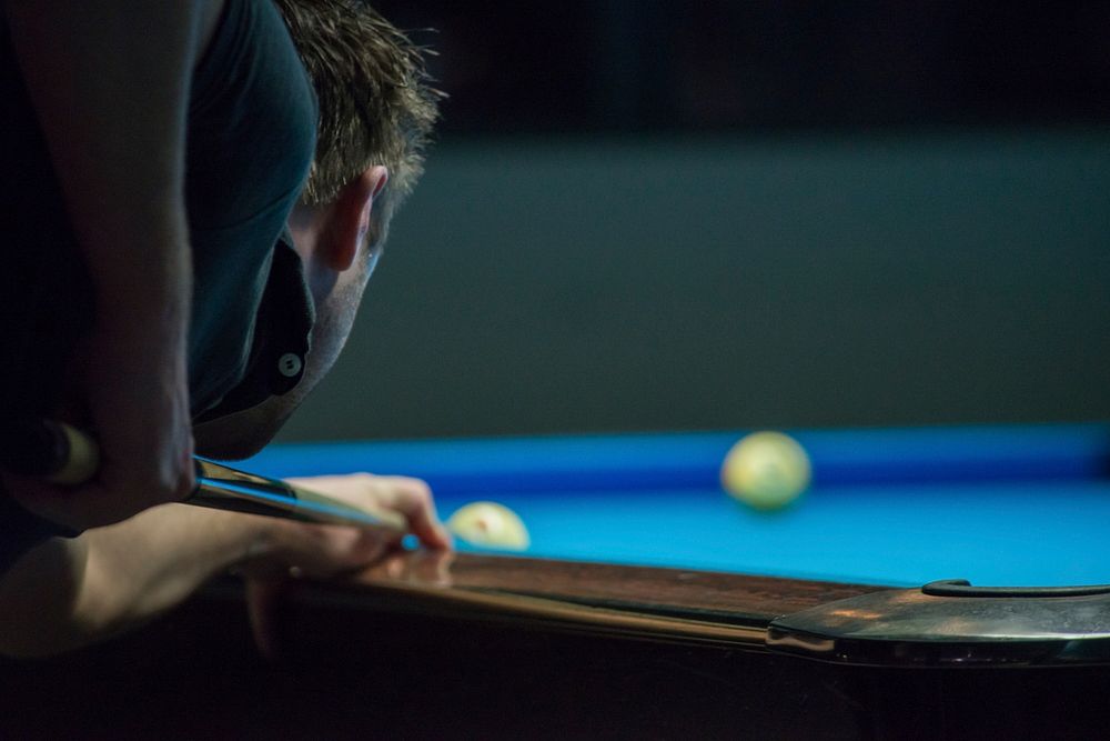 Free man playing pool image, public domain CC0 photo.