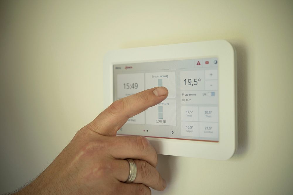 Free hands adjusting air conditioner temperature image, public domain CC0 photo.