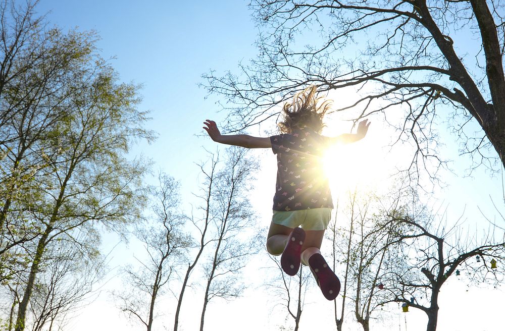 Free girl on trampoline image, public domain person CC0 photo.