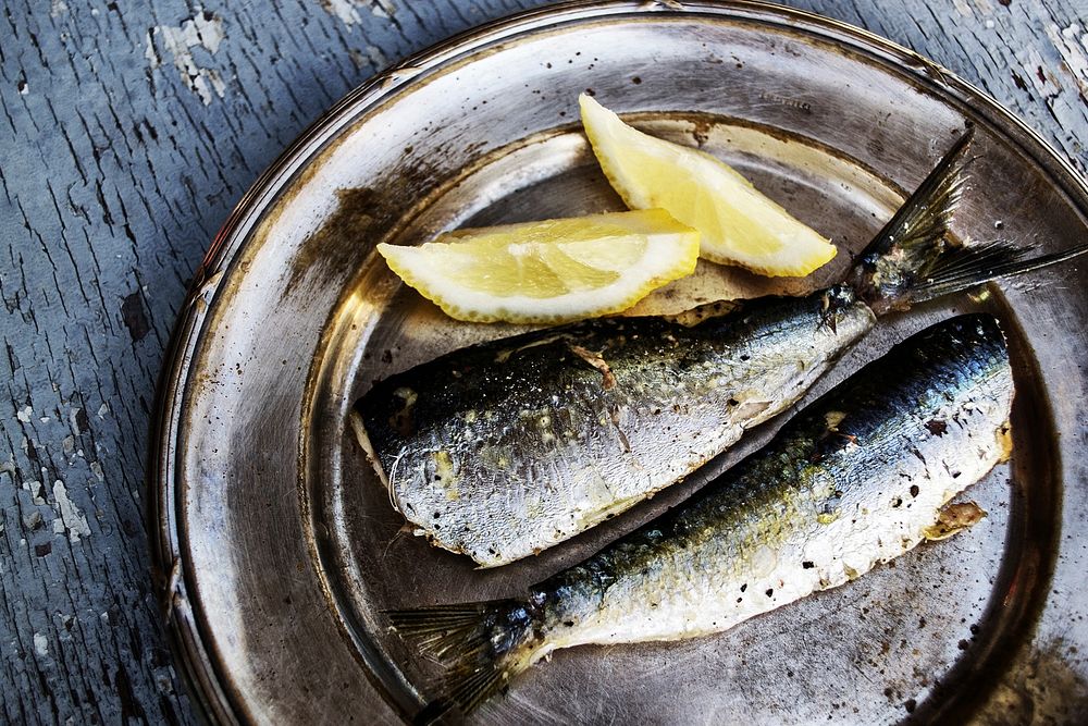Free sardines and lemon on a metal plate image, public domain food CC0 photo.